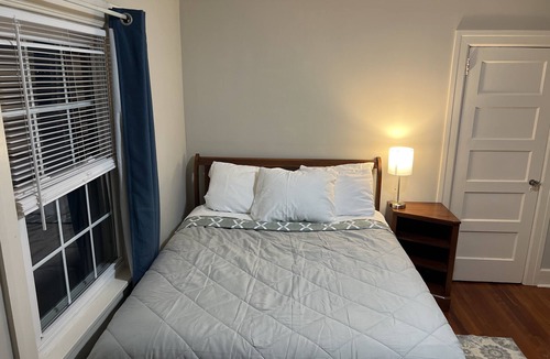 Summit House | Private bedroom in second floor with a share bathroom in a family home.
