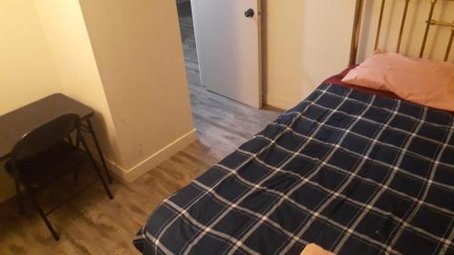 Northeast Edmonton House | Private bedroom with queen bed