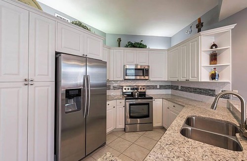 Vanderbilt Beach Condo | Private extended deck with steps down to the pool! - Reg 5-205