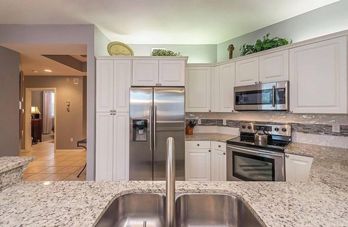 Vanderbilt Beach Condo | Private extended deck with steps down to the pool! - Reg 5-205