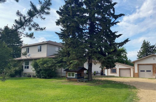 Ma-Me-O Beach House | Private guest suite with a king bed, in a country home, minutes from Wetaskiwin.