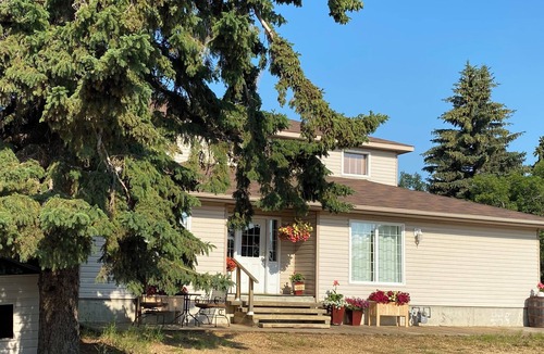 Ma-Me-O Beach House | Private guest suite with a king bed, in a country home, minutes from Wetaskiwin.