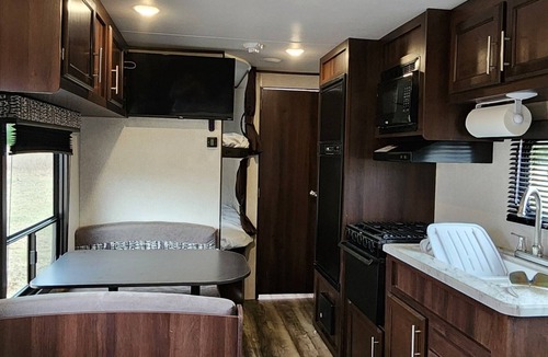 Oshkosh RV Rental | Private Paradise Camper Beach, Pond, Firepit