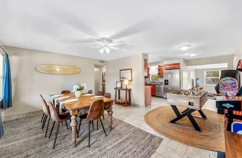 Cocoa Isles House | Private Pool + Hot Tub + Outdoor Movie Nights — Relax in your own backyard oasis with a heated pool, spa, fire pit, and fire up the projector under the stars. Located in famous Cocoa Beach near Kennedy Space Center, Disney & Port Canaveral!