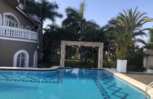 Mobarak City Apartment | Private resort type condo setting with full access to garden and pool