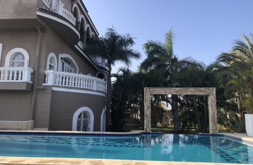 Mobarak City Apartment | Private resort type condo setting with full access to garden and pool