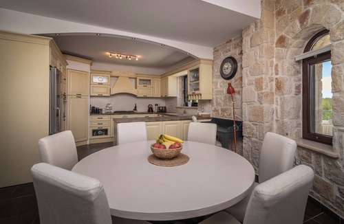 Agia Marina Villa | Private stone villa with heated pool & large outside area, set atop on hillside