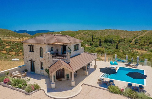 Agia Marina Villa | Private stone villa with heated pool & large outside area, set atop on hillside
