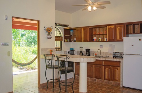 Dominical Apartment | Private suite 103 with beautiful gardens, shared pool and BBQ area!