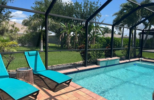 Pelican House | Private Tropical Oasis Heated Pool Outdoor Living Perfect Family Vacation