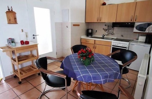 Altfunnixsiel Apartment | Pure family friendliness – is offered by this ground-level apartment with a terrace, a boat jetty and a grill area