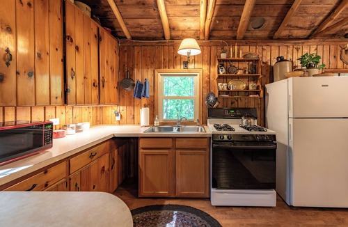 Harrison Cabin | Quaint and cozy log and knotty pine cabin close to lakes.