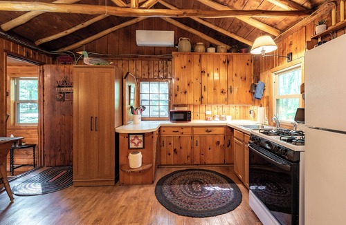 Harrison Cabin | Quaint and cozy log and knotty pine cabin close to lakes.