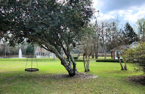 Midway Cottage | Quaint Cottage with Covered Dock on the Pond and Walking Trails in Georgia