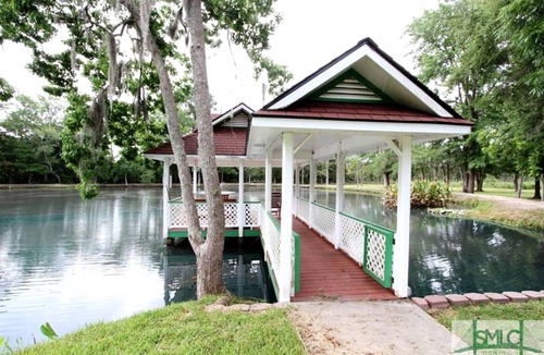 Midway Cottage | Quaint Cottage with Covered Dock on the Pond and Walking Trails in Georgia