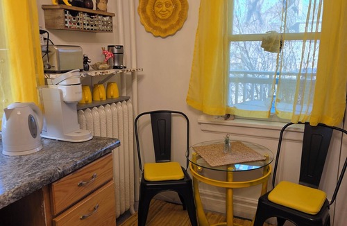 Merriam Park Apartment | Quiet Balcony midst lilac trees awaits! Sleeps 4, dog and child friendly!