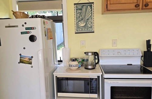 Raglan House | Raglan beach hideaway, stunning views. 5 minute walk to the Famous Raglan Wharf.