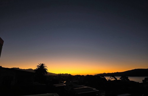 Raglan House | Raglan beach hideaway, stunning views. 5 minute walk to the Famous Raglan Wharf.
