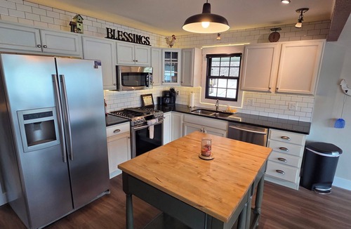 Sunrise Beach House | Rare level lot with boat launch on site. Wood burning fireplace. Dog friendly.