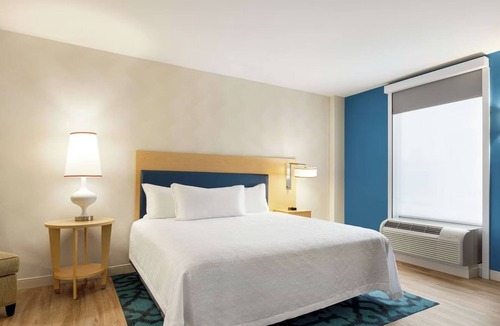 Queens Hotel | Refreshingly Stylish King Suite w/Expanded Bedroom Comfort & a Welcoming Lounge