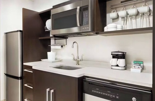 Queens Hotel | Refreshingly Stylish King Suite w/Expanded Bedroom Comfort & a Welcoming Lounge