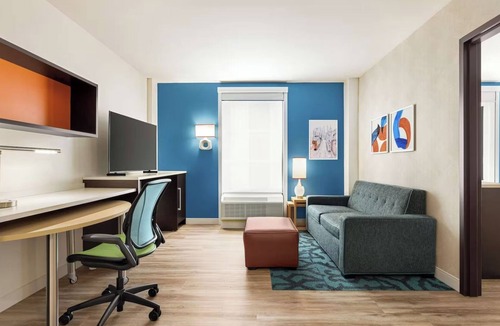 Queens Hotel | Refreshingly Stylish King Suite w/Expanded Bedroom Comfort & a Welcoming Lounge