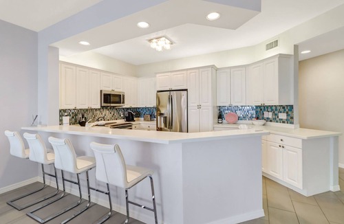 Pelican Bay Condo | Regatta at Vanderbilt, upscale condo - 8 min walk to the beach! Great Bay views!