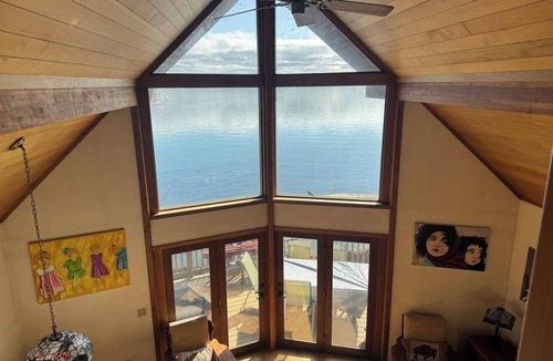 Romulus House | Relax at Poplar Beach Retreat on the sparkling waters of Cayuga Lake. This charming waterfront escape combines rustic character with bright, comfortable living spaces, creating the perfect setting for a relaxing Finger Lakes getaway.