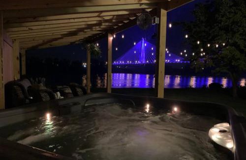Russell House | Relax at Rivertime with a Bridge and River view, plus a HotTub