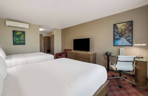 Calgary Hotel | Relax in Style: 4 Spacious Rooms, Indoor Swimming Pool and Free Shuttle