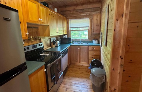 Evanston Cottage | Relaxing Cedar Log Cottage on Bras d'Or Lake over 300 Ft Private Beach & Kayaks