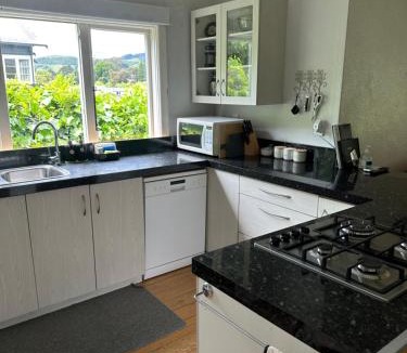 Nelson South House | Relaxing sunny Nelson retreat, balcony views & easy walk to CBD