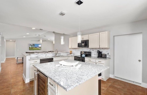 Palm Harbor House | Relaxing Waterfront Stay | Dock & Pool Heat Opt
