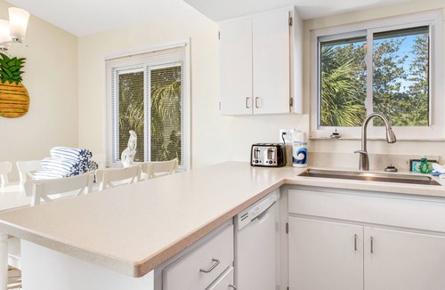 Holmes Beach House | Remodeled duplex with heated private pool - close to beach, dogs welcome
