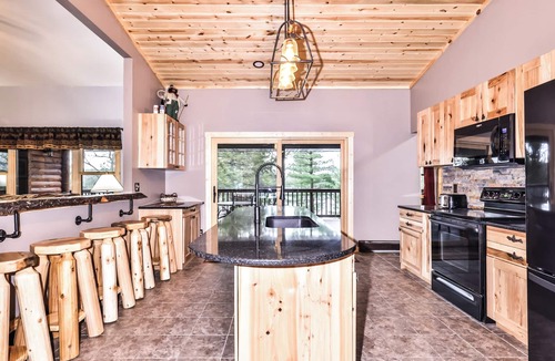St Germain House | Remodeled lakeside resort lodge with fireplace, sandy beach, dock, firepit!
