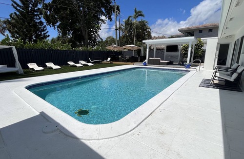 Deerfield Beach House | RESORT-STYLED 3 BDR HOME -HEATED POOL -UNDER A MILE FROM THE BEACH Huge Backyard