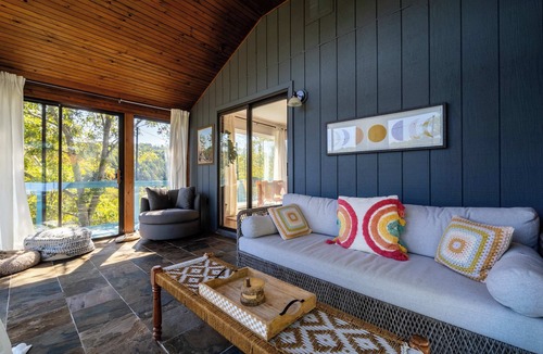 East Stroudsburg House | Riverfront Cabin | Fire Pit, Soaking Tub, Dogs OK