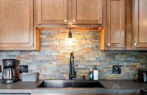 Hessel Cabin | Riverfront Cabin Incredible for Outdoor Enthusiasts with Kayaks in Hessel, Michigan