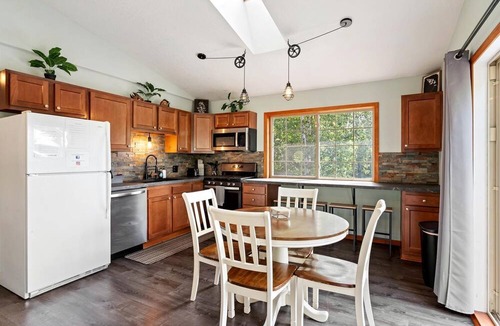 Hessel Cabin | Riverfront Cabin Incredible for Outdoor Enthusiasts with Kayaks in Hessel, Michigan