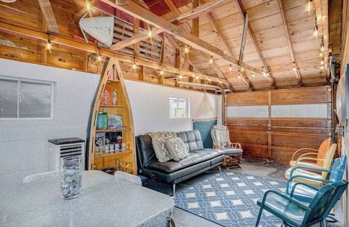 Honor House | Riverfront cabin with furnished deck, beautiful backyard, firepit & kayaks