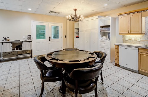 Wiley House | Riverfront hideaway with grill, game room, home theater, screened porch, & deck