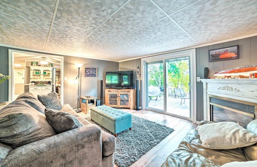 Cheboygan Cottage | Riverfront Home w/Dock ~ 6 Mi to Cheboygan!