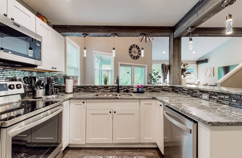 Mason County House | Riverfront property with three cabins, hot tubs, firepits, kayaks - beach access