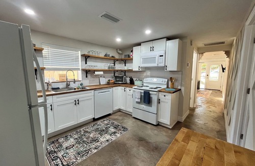 Weeki Wachee Gardens House | Riverfront Retreat on deep canal with Hot Tub, Clear Kayaks & Fire pit