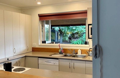 Broadlands Forest House | Riverside accommodation which is perfect for groups. Pizza oven, covered deck.