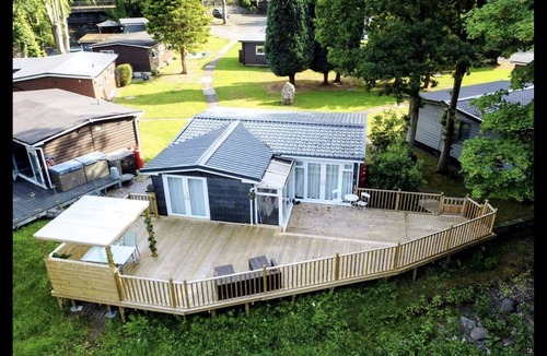 Bont Newydd Cabin | Riverside Cabin with Large Decking Area set in 120 acre Country Park, Snowdonia
