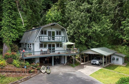 Brinnon House | Riverside luxury, with a hot tub, in the woods.