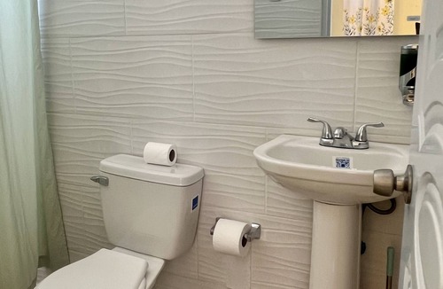 Higuey Hotel | Romantic Hispanic 304 private room with refrigerator and dining area.