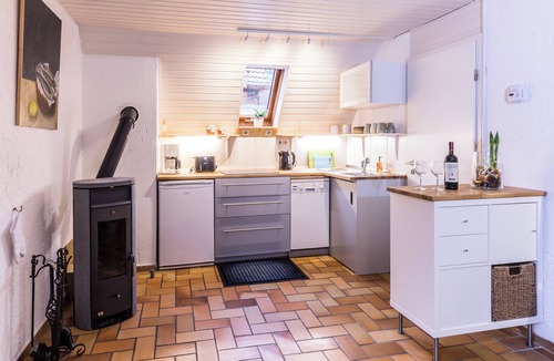 Dimbach House | Romantic holiday home with a large sun terrace and fireplace