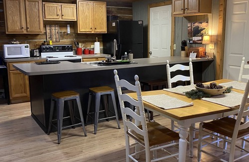 New Rumley Cabin | Rustic Cabin Retreat on 120 Acres with Private Lake, Wildlife, and Fireplace.